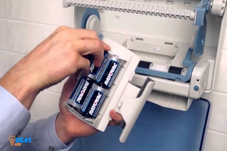 how to change batteries in paper towel dispenser